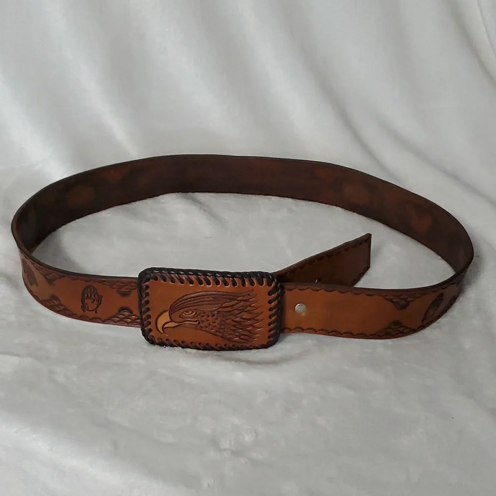 Vintage Leather Belt With Eagle Buckle and Details Embossed Along the Strap.